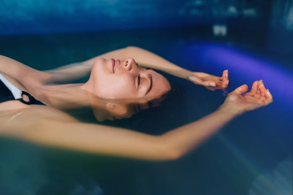 Person peacefully enjoying float therapy in the Sisu Longevity Studio float tank in Colorado Springs