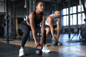 Two people engage in a longevity training at Sisu Longevity Studio, promoting energy and wellness in the the strongest decade.