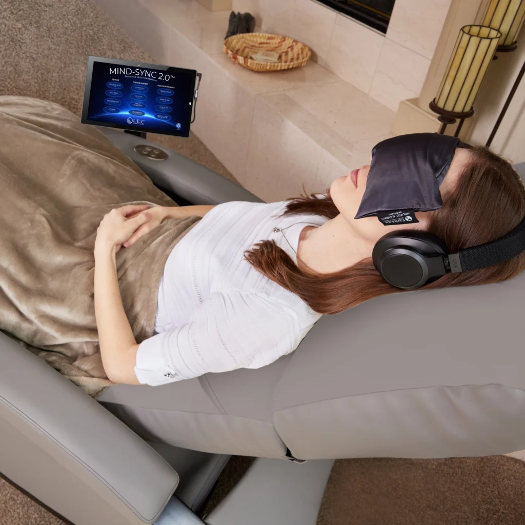 Person resting on the LEC MindSync 2.0 vibroacoustic lounger at Sisu Longevity Studio in Colorado Springs