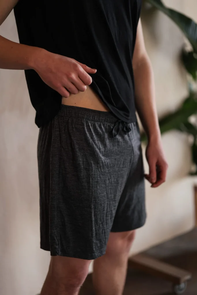 Person wearing casual workout attire, embodying wellness and energy in a relaxed environment.