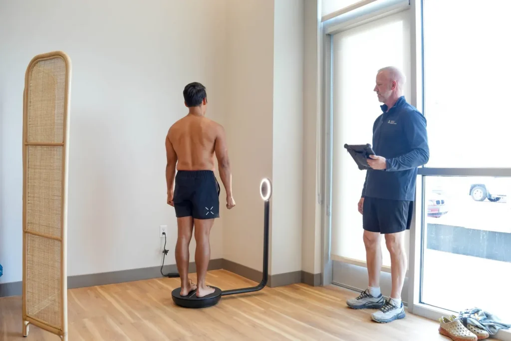Coach reviewing a body composition scan with a client during the Sisu Assessment